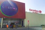 Carrefour signage sits on top of the Cosmos Shopping Mall in Abidjan.