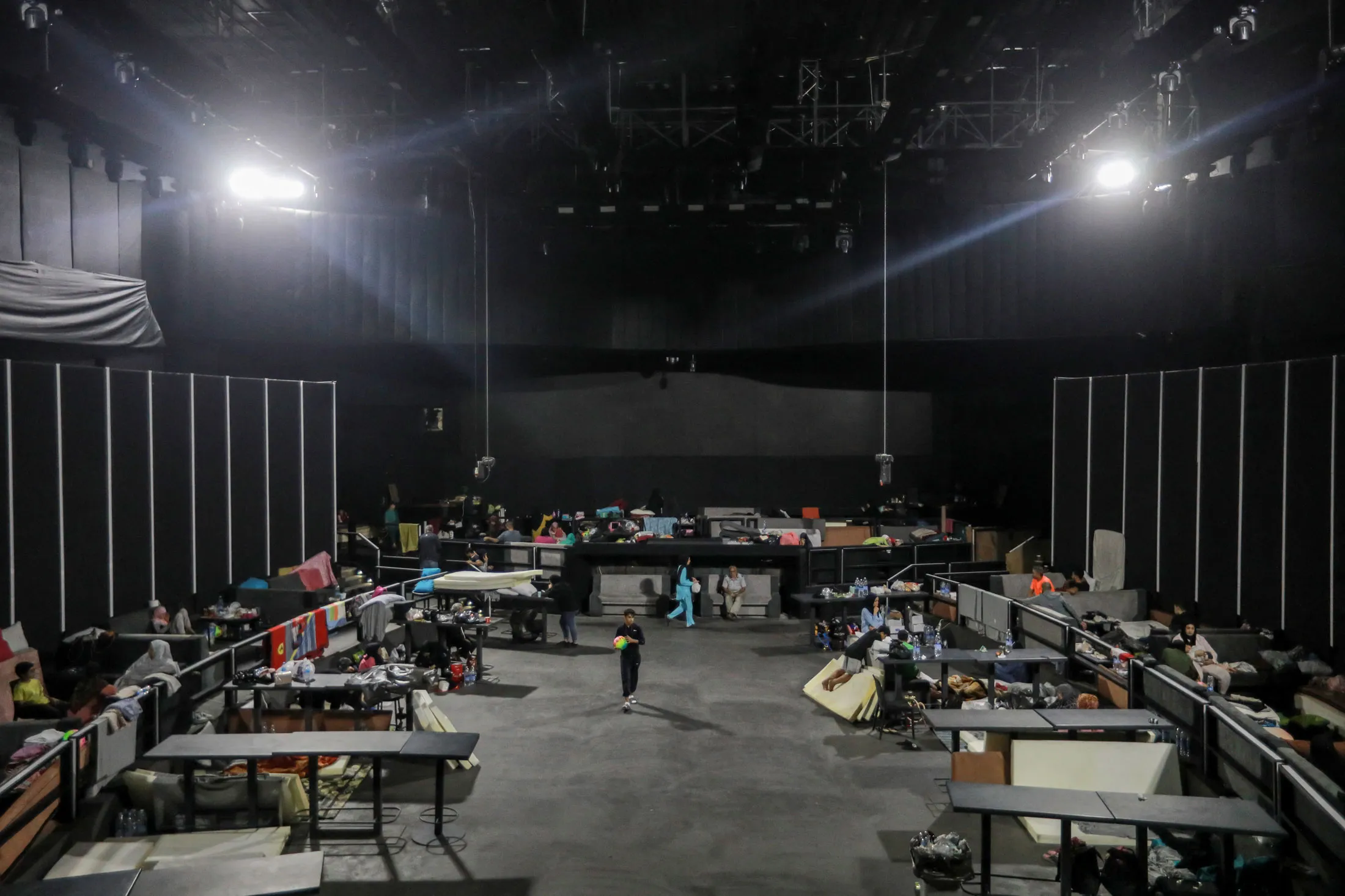 Internally displaced families take shelter at a nightclub in Beirut.
