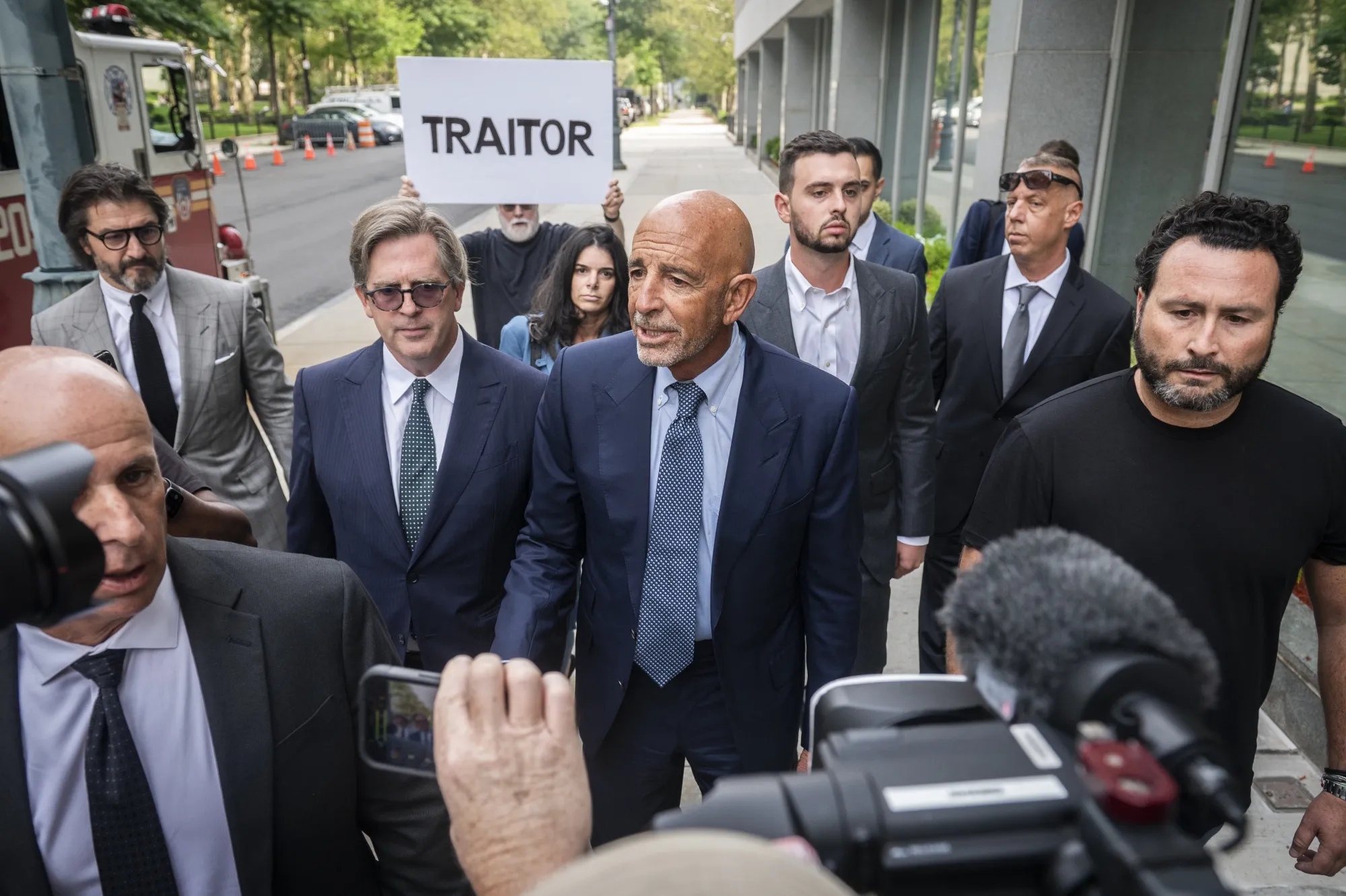 Tom Barrack, center, arrives at criminal court in New York on July 26.