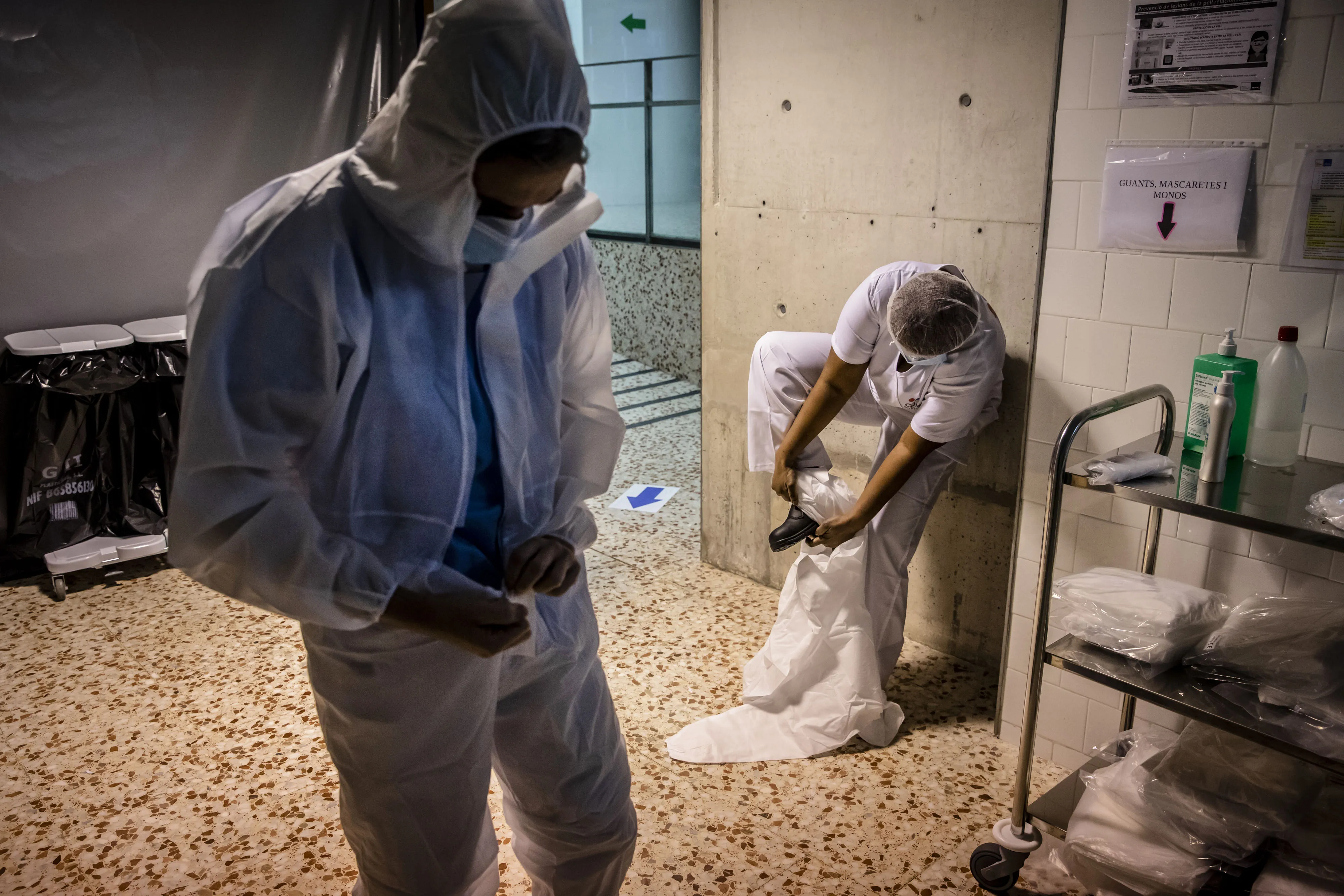 Health workers protect themselves with personal protective equipment&nbsp;before entering the Hospital Del Mar temporary field hospital set up to receive Covid-19 patients in Barcelona, on April 10.