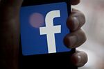 The Facebook Inc. logo is displayed for a photograph on an Apple Inc. iPhone in Washington, D.C., U.S., on Wednesday, March 21, 2018.