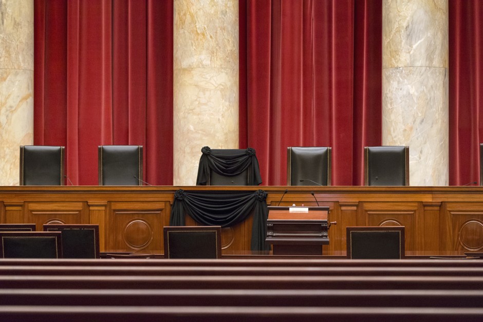 Supreme Court Justice Antonin Scalia’s vacant courtroom chair is draped in black to mark his death.