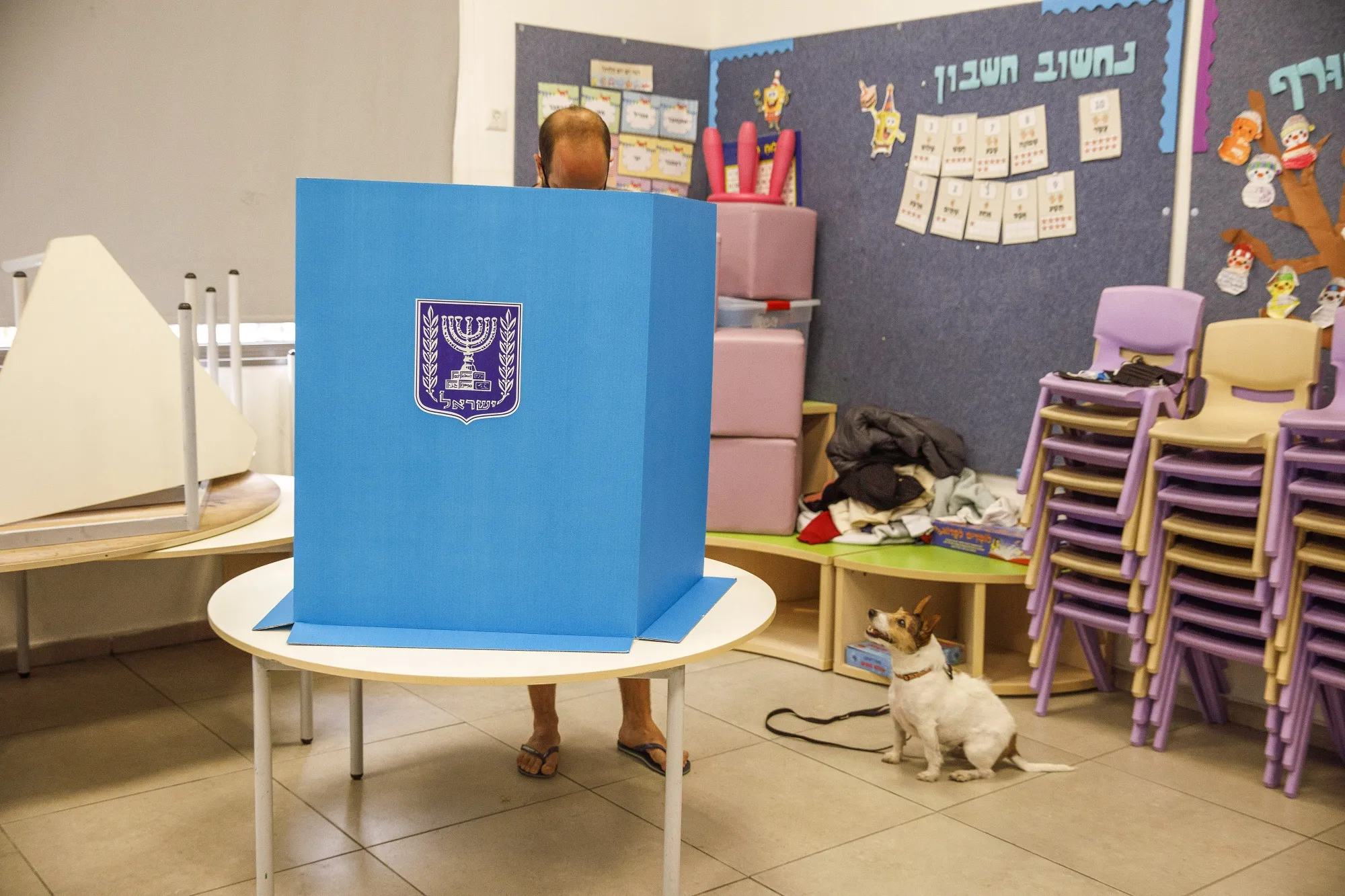 A voter casts their ballot in a polling station in Tel Aviv, Israel.