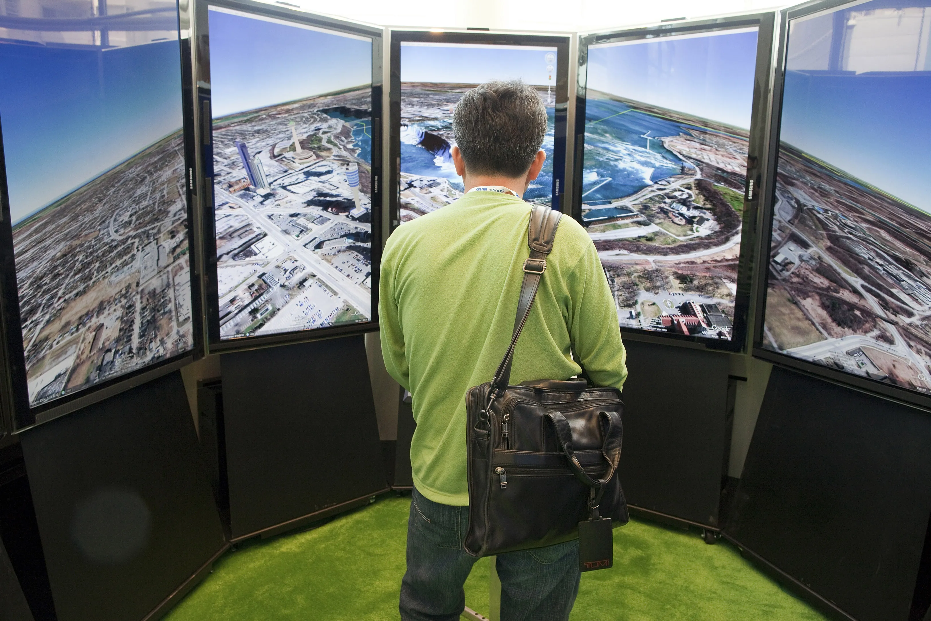 An attendee uses the Google Earth booth during the Google I/O conference in San Francisco. Photographer: David Paul Morris/Bloomberg