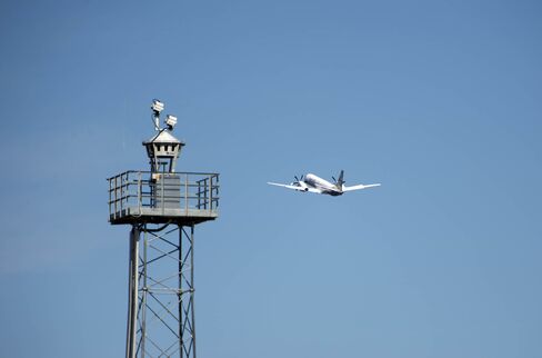 An airplane flies by a Saab's Remote Tower system in Ornskoldsvik, Sweden.