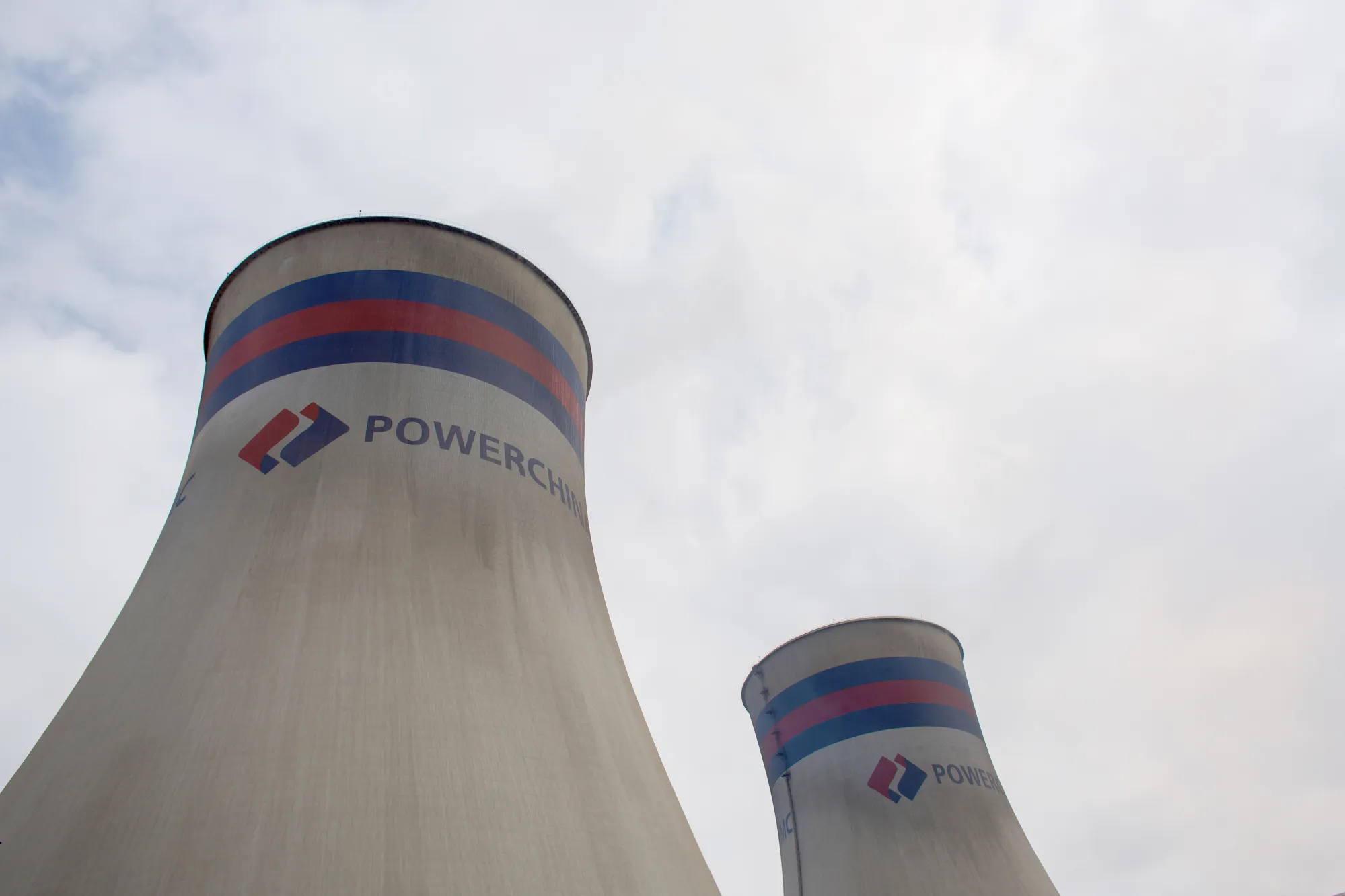 The logo of Power Construction Corp. of China on cooling towers at the Port Qasim coal power plant in Sindh Province, Pakistan.