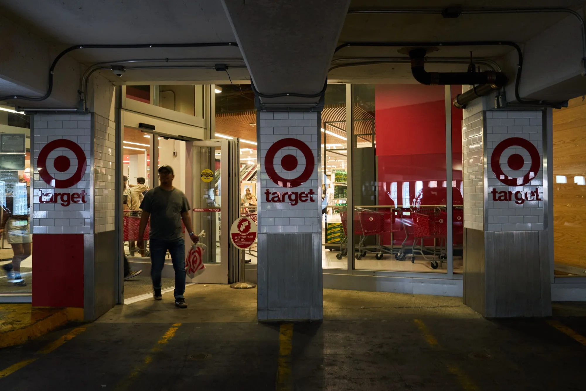 A shopper exits a Target store in the Queens borough of New York.