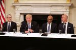 U.S. President Donald Trump welcomes members of his American Technology Council, including (from left) Apple CEO Tim Cook, Microsoft CEO Satya Nadella and Amazon CEO Jeff Bezos at the White House June 19.
