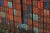 Shipping containers sit stacked on the Hyundai Force container ship at the Jawaharlal Nehru Port, operated by Jawaharlal Nehru Port Trust (JNPT), in Navi Mumbai, Maharashtra, India, on Saturday, Dec. 16, 2017. Many of the cargo containers passing through India's busiest port in Mumbai have a small piece of Japan Inc. attached: Devices from NEC Corp. that can be tracked as the containers rumble through the interior of Asia's third-largest economy.