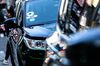 Uber Technologies Inc. and Lyft Inc. stickers are displayed on a vehicle in the Time Square neighborhood of New York, U.S., on Wednesday, May 8, 2019. Simmering tensions between drivers and ride-hailing companies are flaring again, as drivers in major cities across the U.S. and the U.K. went on strike Wednesday over low wages and unstable working conditions.