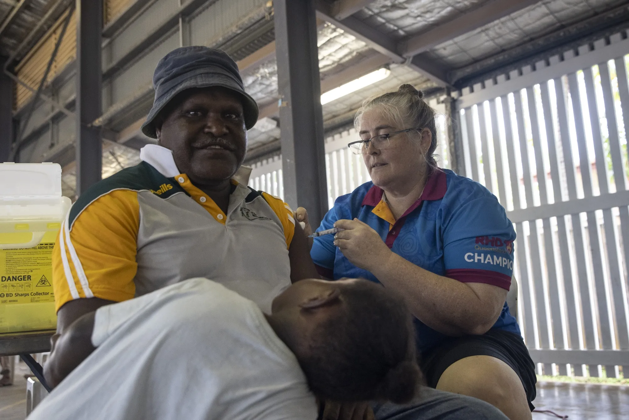 A man receives an AstraZeneca shot at a&nbsp;community center on&nbsp;Boigu Island, Australia.