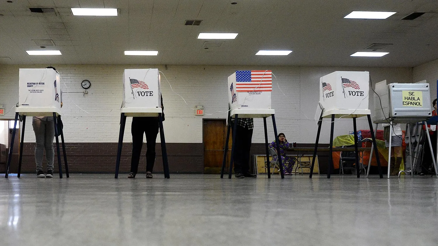 Sun Valley residents vote at Our Lady of The Holy Church on election day at the predominantly Latino Sun Valley district of Los Angeles on November 6, 2012 in California.
