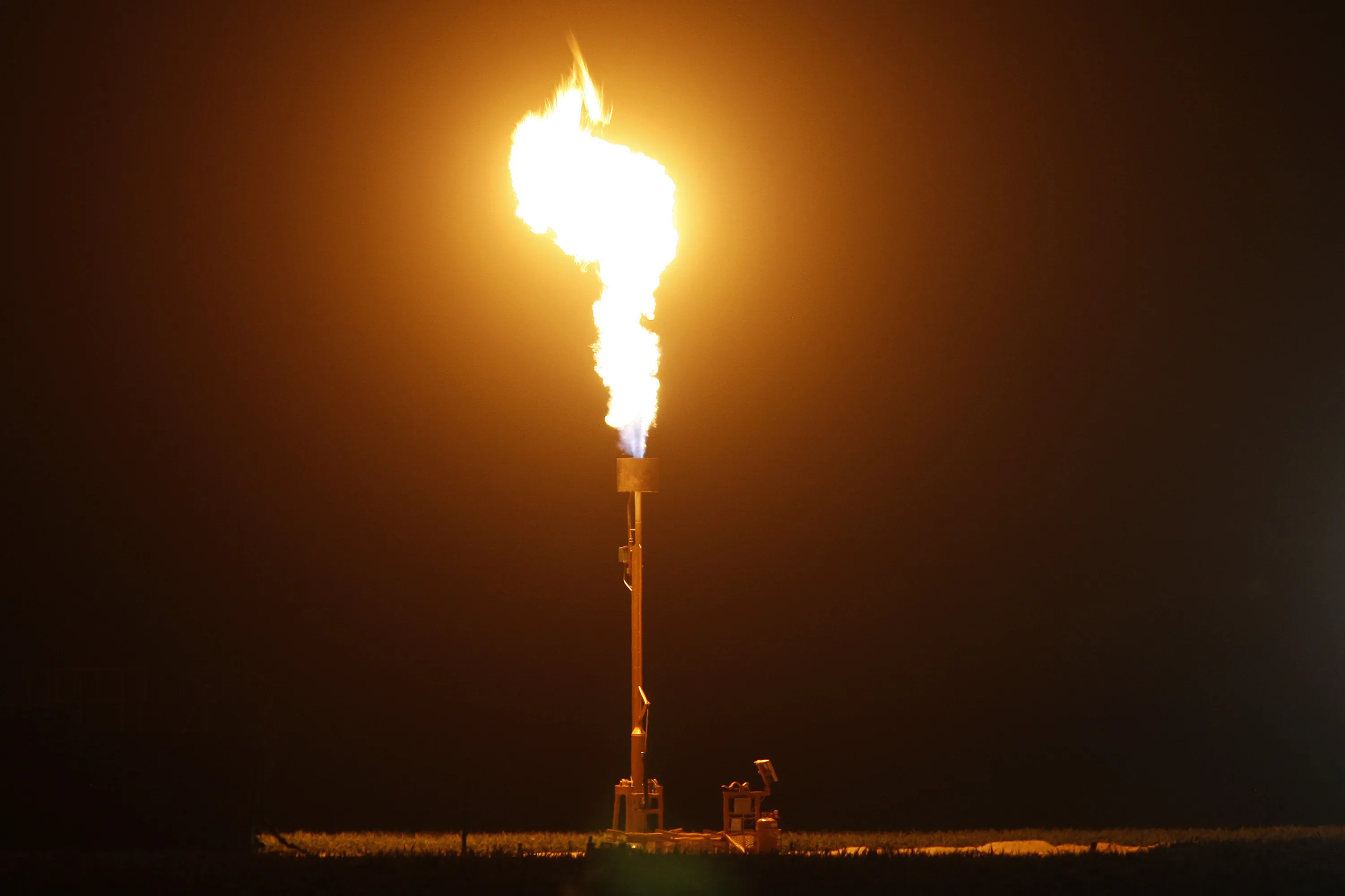 Lighting gas and cash on fire.