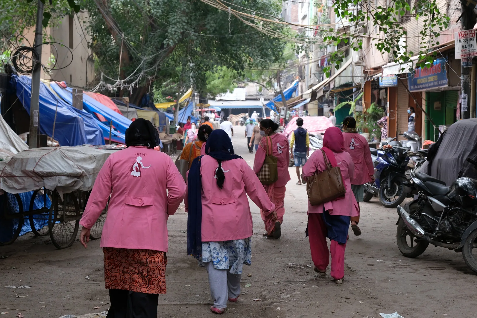 ASHA members conduct a door-to-door coronavirus survey in New Delhi on July 2.