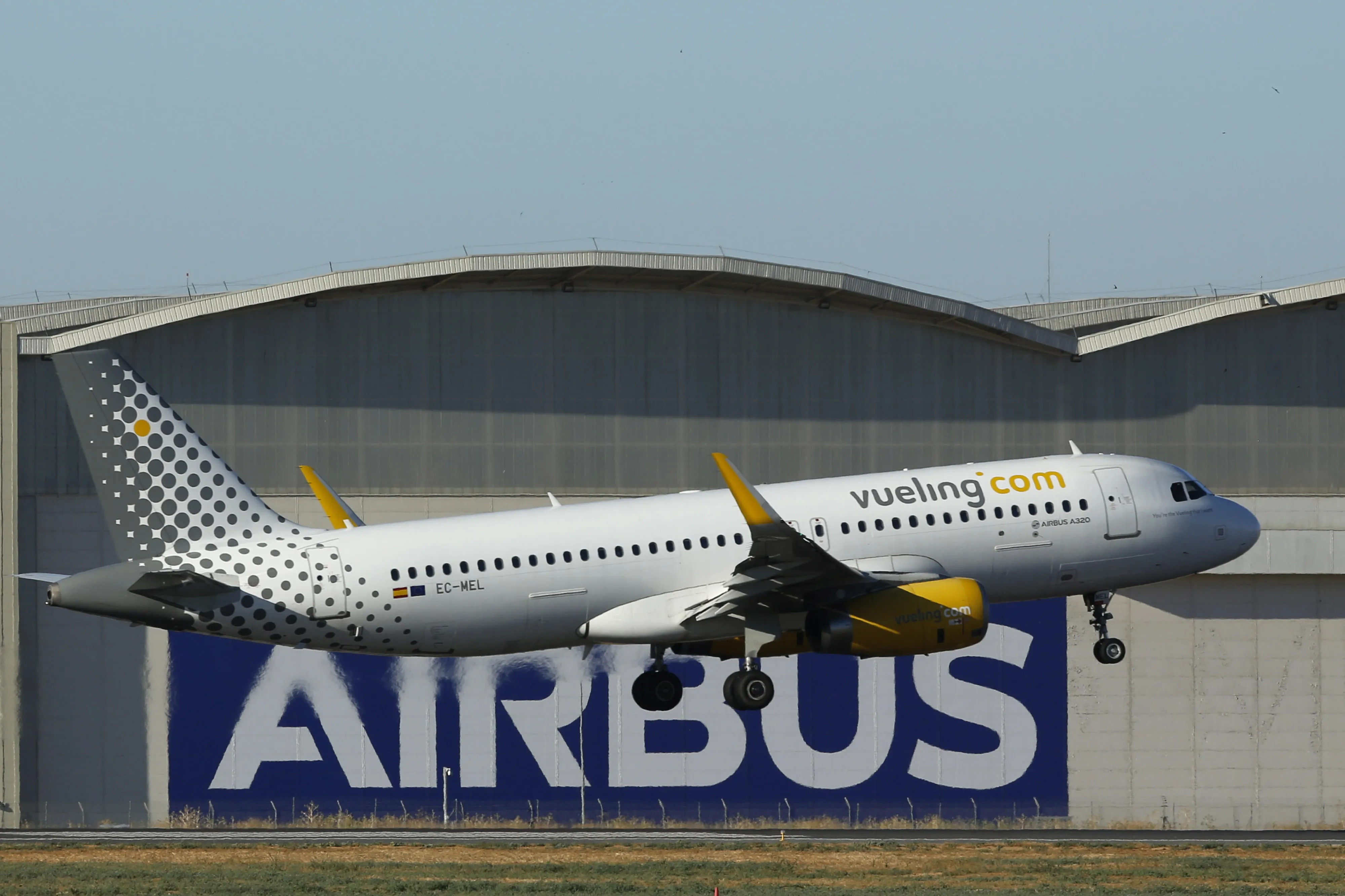 An Airbus A320 passenger jet lands at the Airbus plant in Seville, Spain.