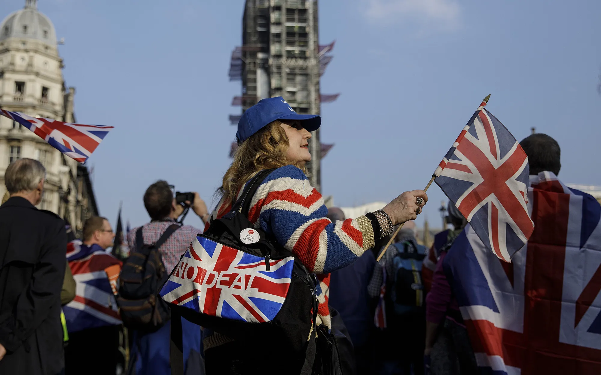 Pro-Brexit campaigners hold Union Flags, also known as Union Jacks, as they rally near the Houses of Parliament in London.
