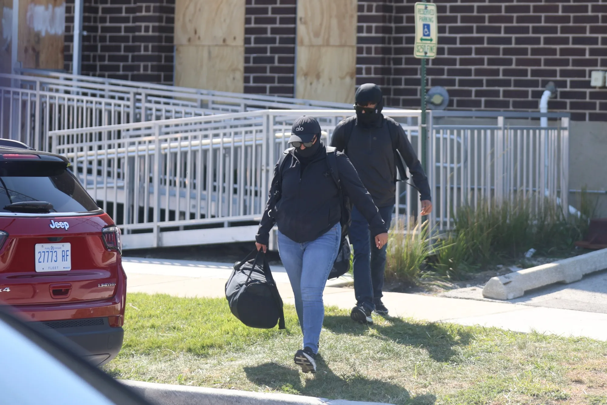 Federal agents exit an ICE processing center in Broadview, Illinois, on Monday.