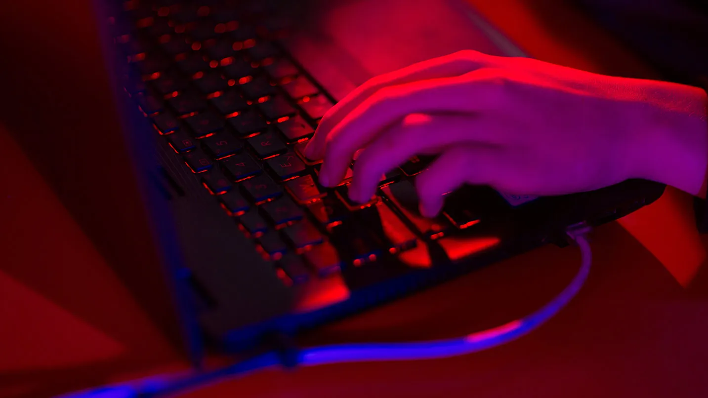 Red light illuminates the keys of a laptop computer at the Dreamhack digital festival in Moscow, Russia, on Saturday, Dec. 5, 2015. Dreamhack is the world's largest digital festival and meeting place for gamers, fans and e-sport enthusiasts.
