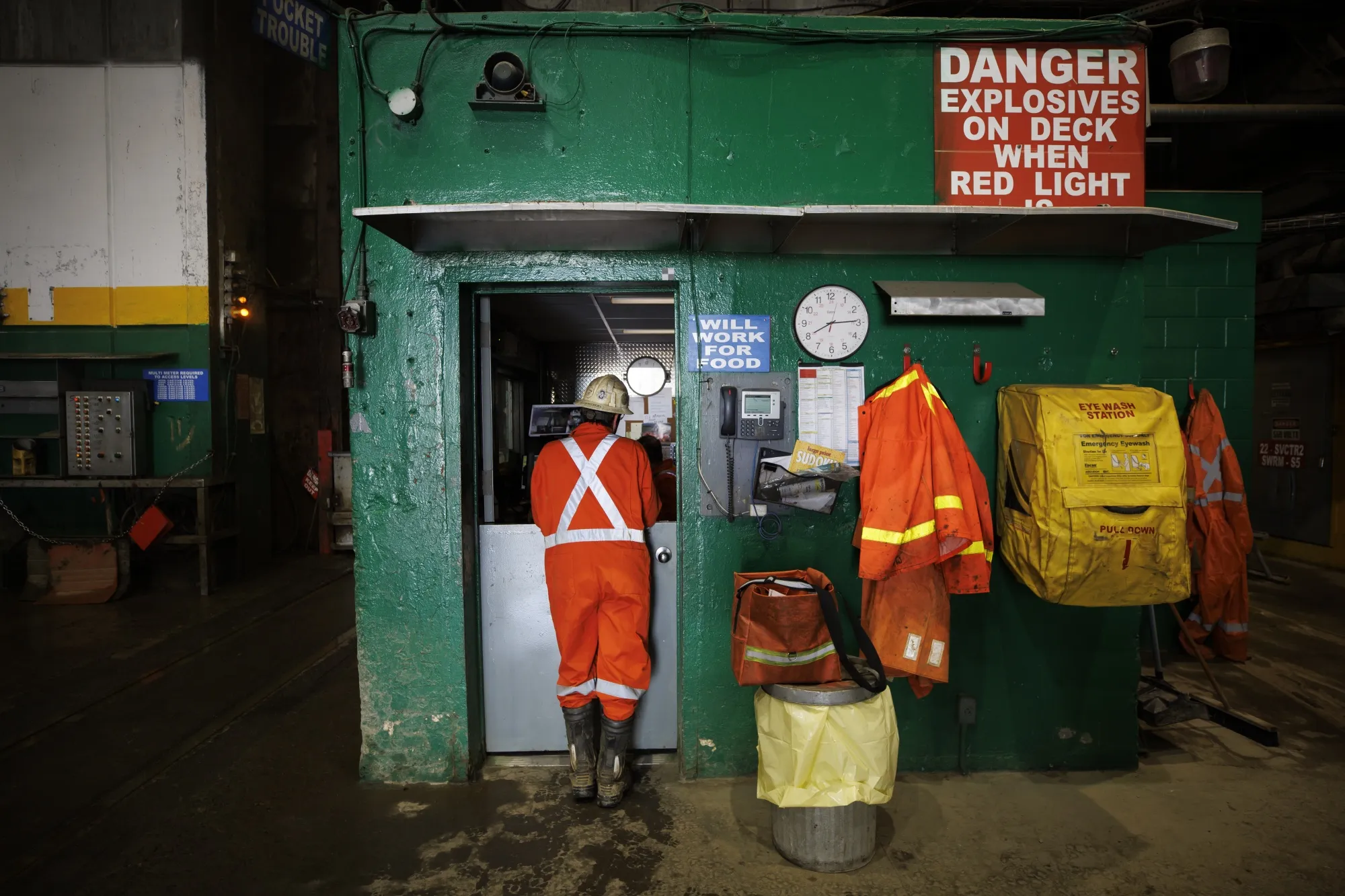 Workers wait for the cage to lower them down the mine shaft at a nickel mine in Ontario, Canada.