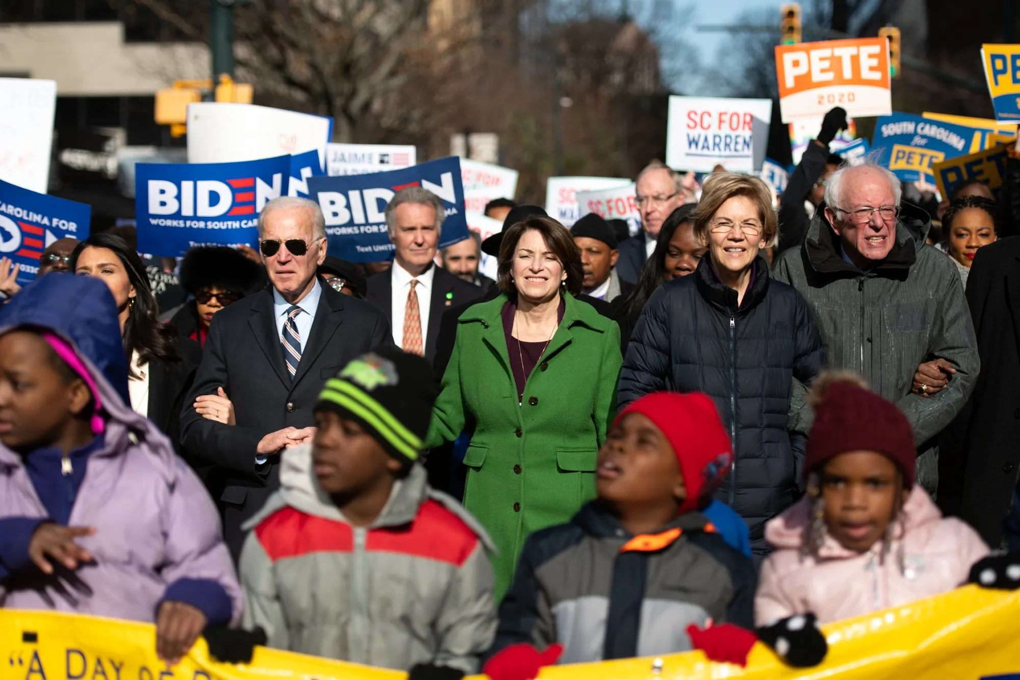 Democratic presidential candidates,&nbsp;Biden, from left, Klobuchar, Warren&nbsp;and Sanders march down Main Street in Columbia, on Jan. 20.&nbsp;