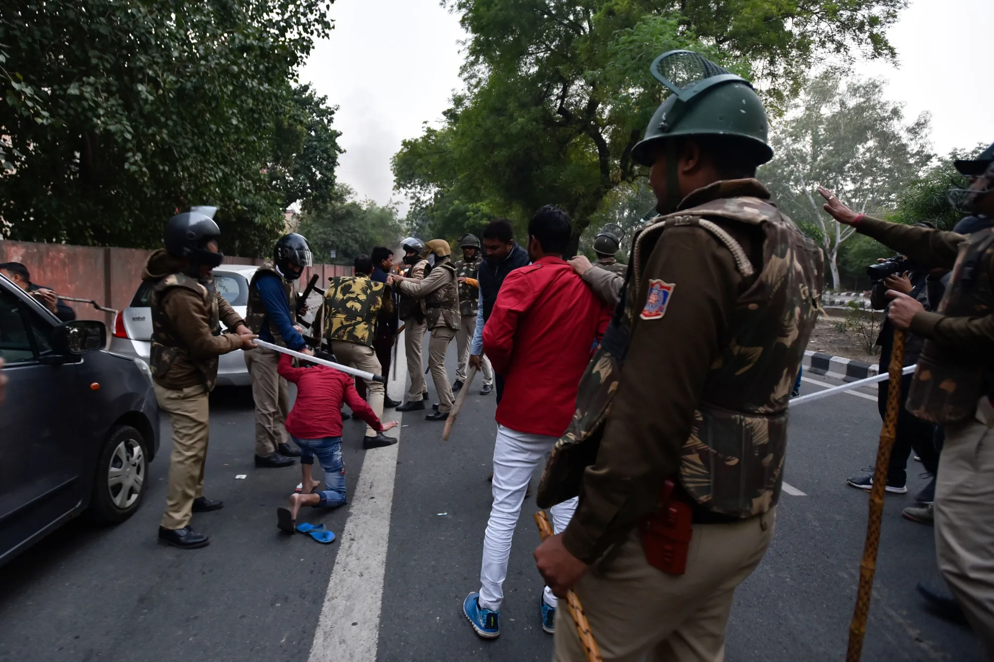 Police clash with demonstrators following a protest against the citizenship bill in New Delhi on Dec. 15.