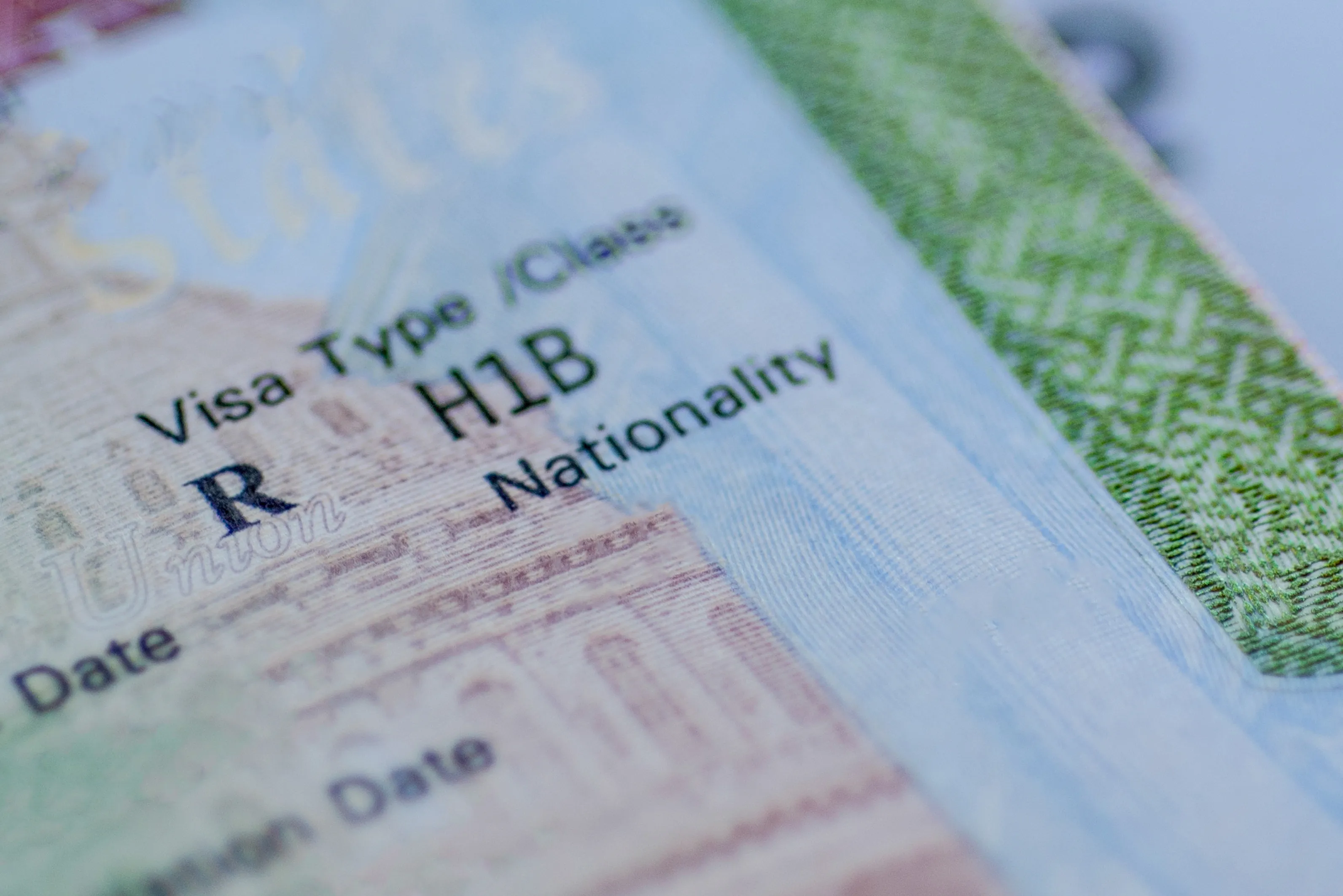 An H1B visa stamp in a passport.