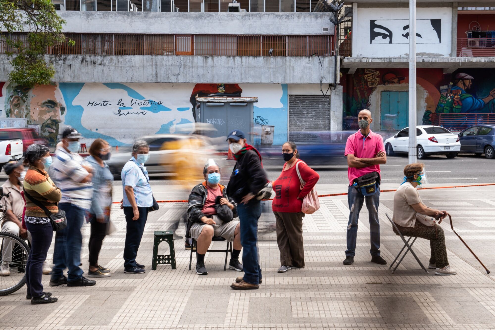 People wait in line to receive a dose of the Sputnik V Covid-19 vaccine. in Caracas, Venezuela.