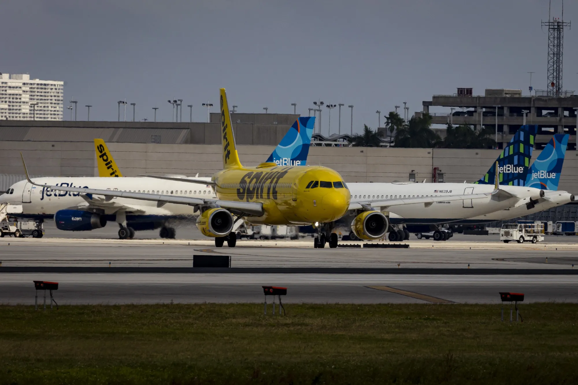 Spirit and JetBlue planes at Fort Lauderdale-Hollywood International Airport (FLL) in Fort Lauderdale, Florida, US, on Wednesday, Nov. 1, 2023.