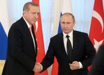 Turkey's president Recep Tayyip Erdogan and Russia's president Vladimir Putin shake hands at a joint press conference following Russian-Turkish talks.
