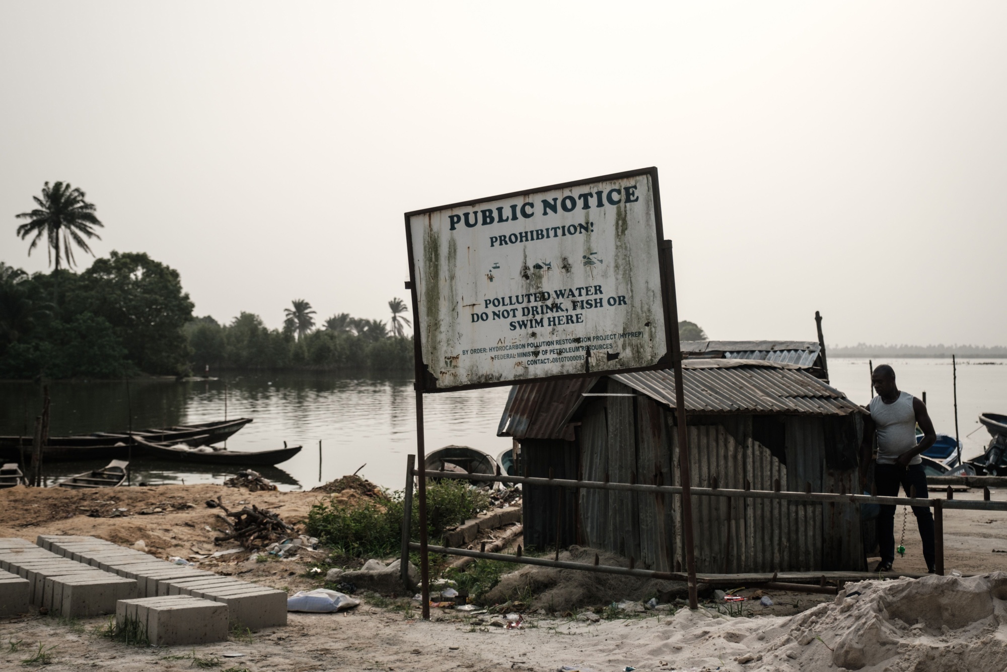 A public warning sign by&nbsp;on the River Bodo, in Nigeria’s&nbsp;Delta region, in 2019.