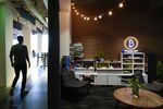 A Bitcoin neon sign is displayed in a lounge area at the Coinbase Inc. office in San Francisco.