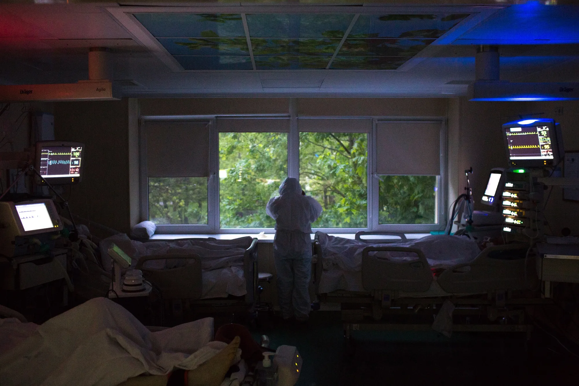 A doctorlooks out of the window as night falls in the intensive care unit at a hospital in Moscow on May 13.