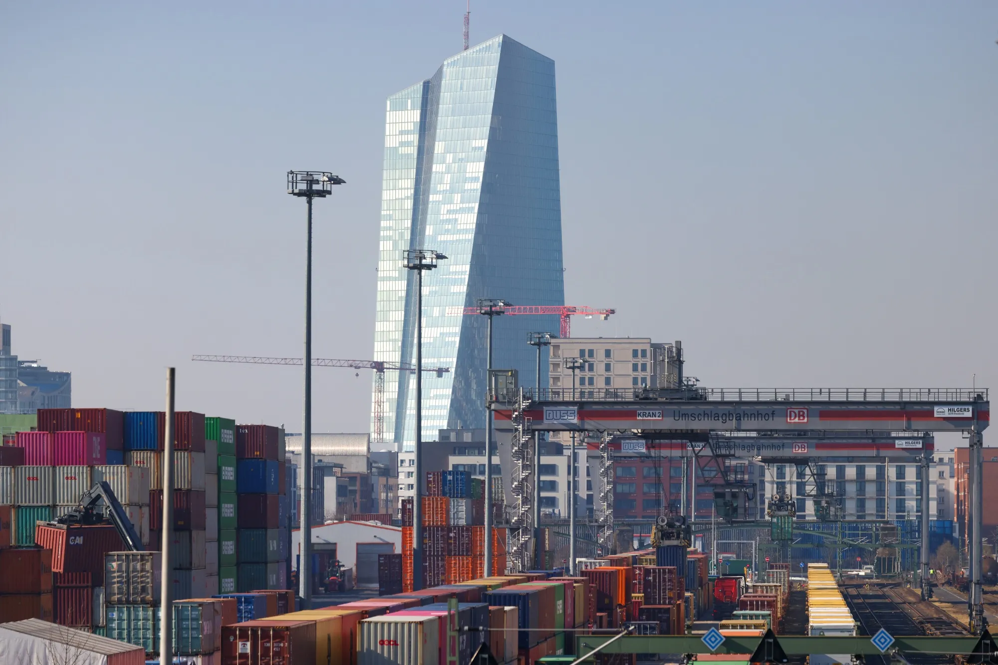 The headquarters of the European Central Bank (ECB) beyond containers at a freight terminal in Frankfurt.