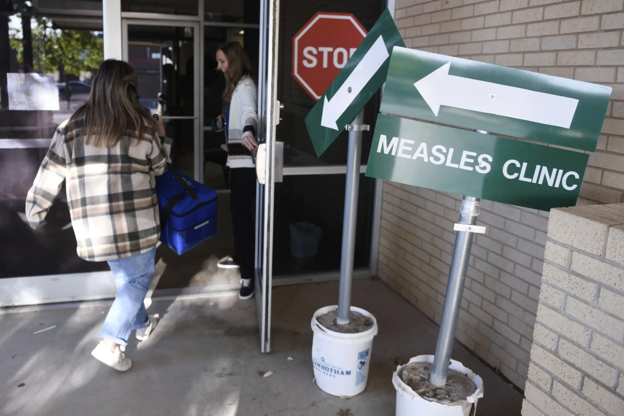 Health department staff members enter a measles clinic in&nbsp;Andrews, Texas, on&nbsp;April 8.