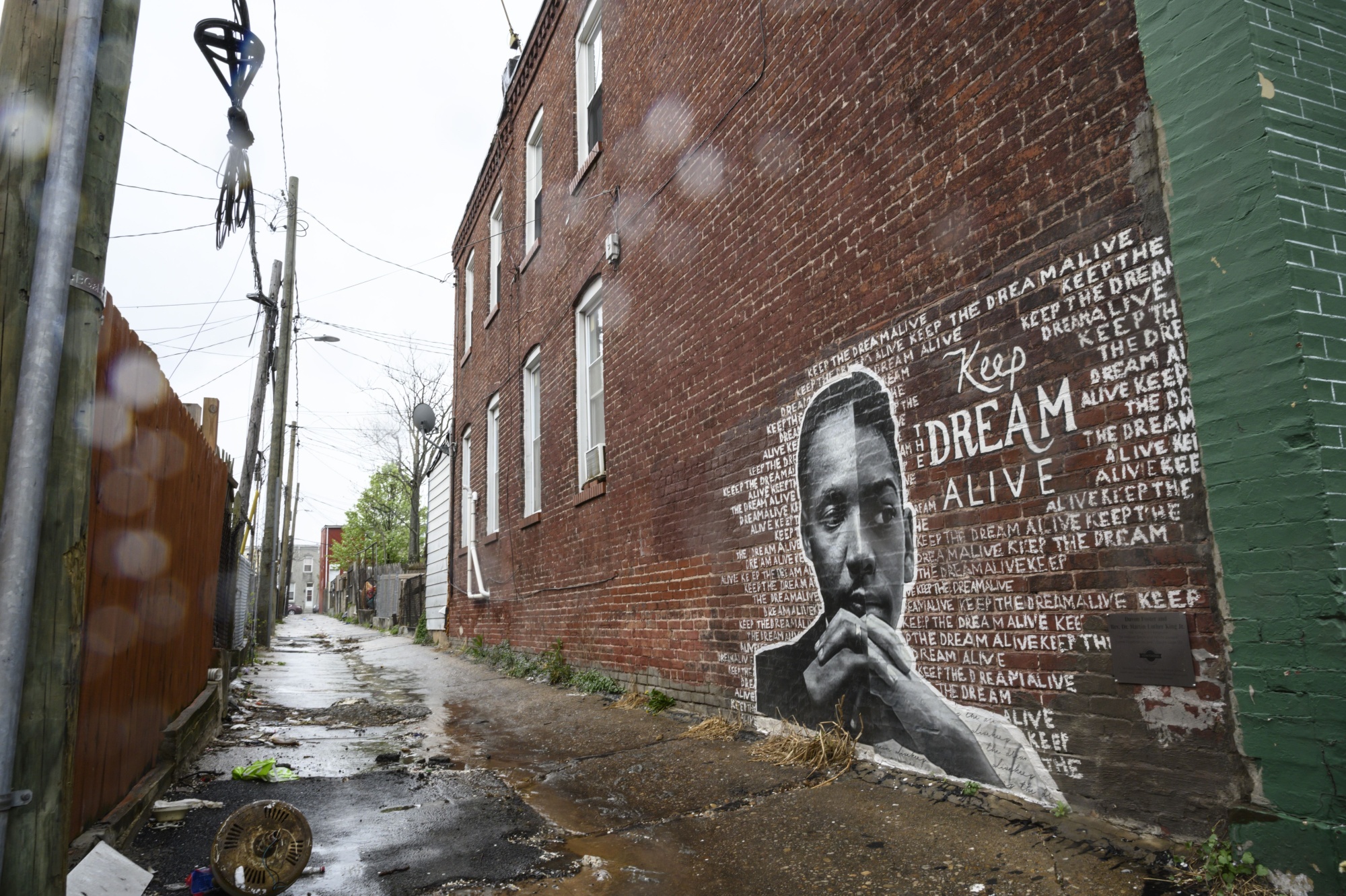 A mural in an alley in East Baltimore, where persistent poverty can be traced to decades-old patterns of housing segregation.&nbsp;