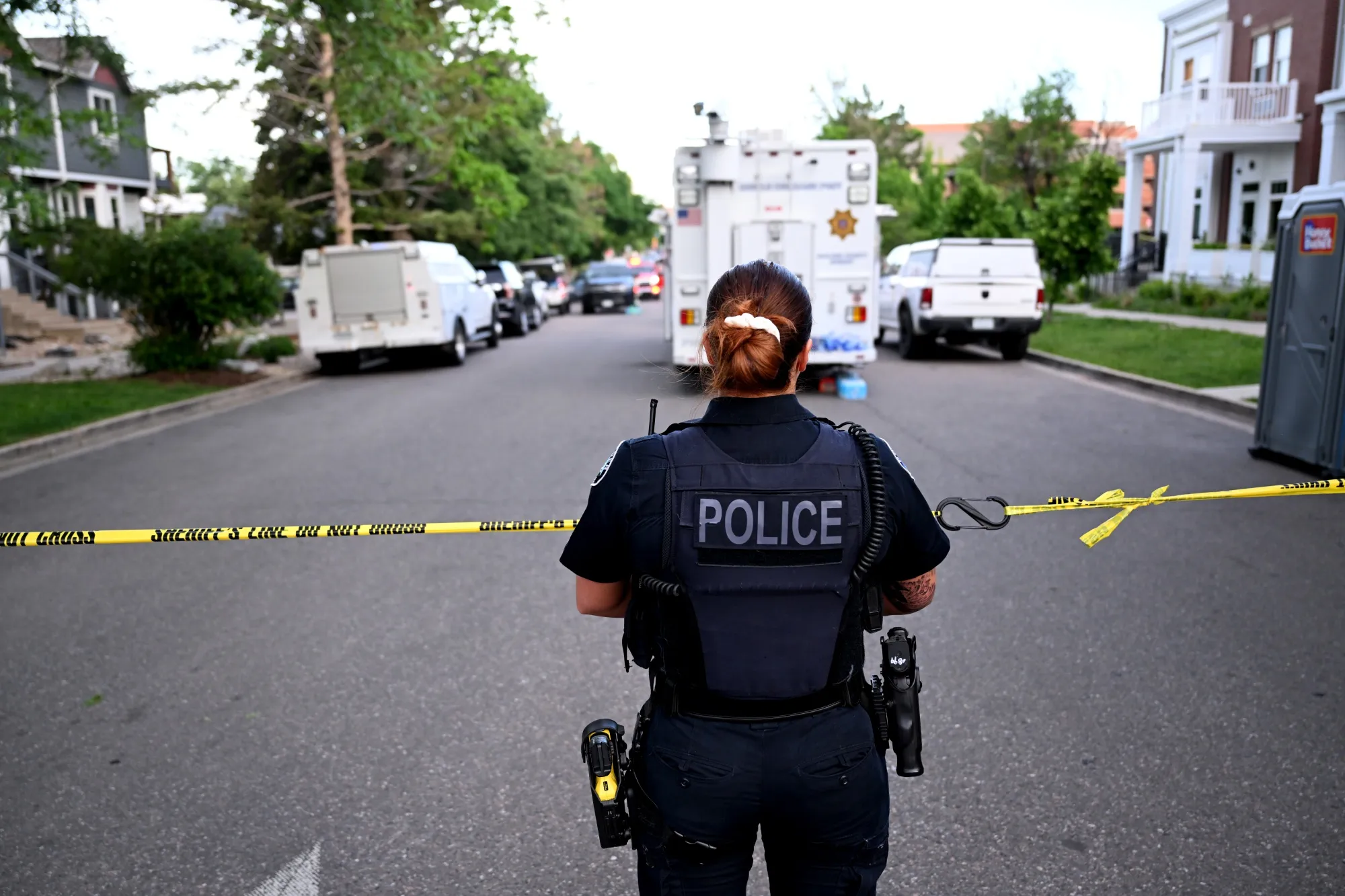 A law enforcement official maintains police lines near the scene of an attack on the Pearl Street Mall in Boulder, Colorado on June 1.