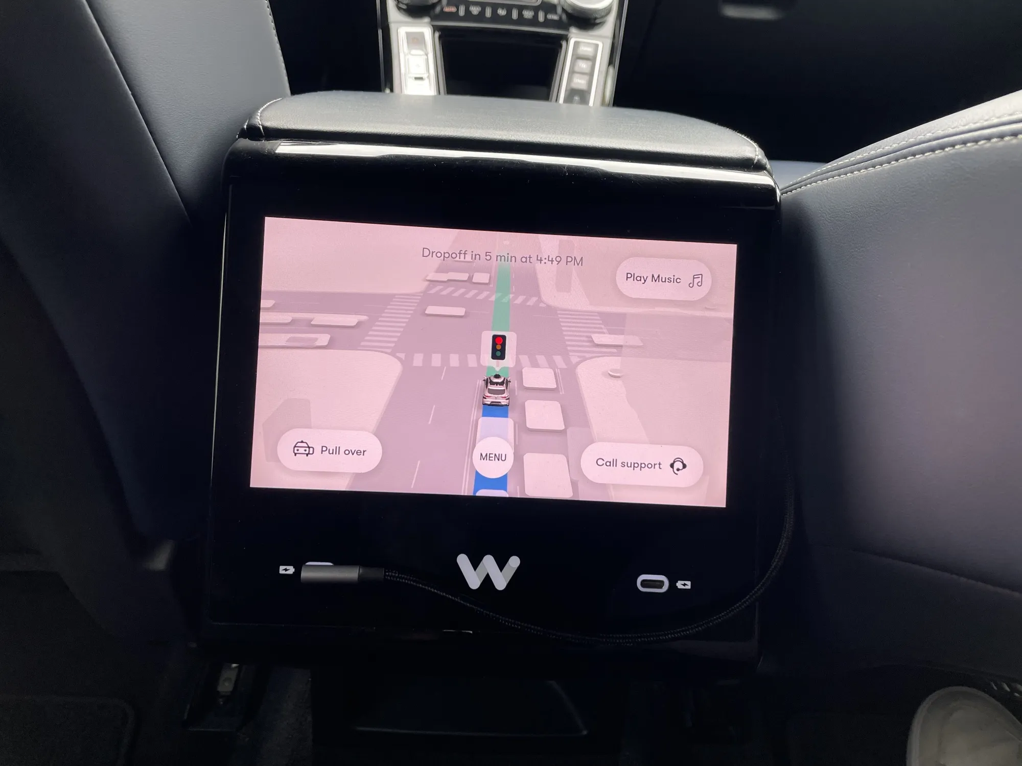 A Waymo display, viewed from the backseat.