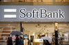 Pedestrians walk past a SoftBank Group Corp. store in Tokyo, Japan.