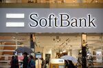 Pedestrians walk past a SoftBank Group Corp. store in Tokyo, Japan.