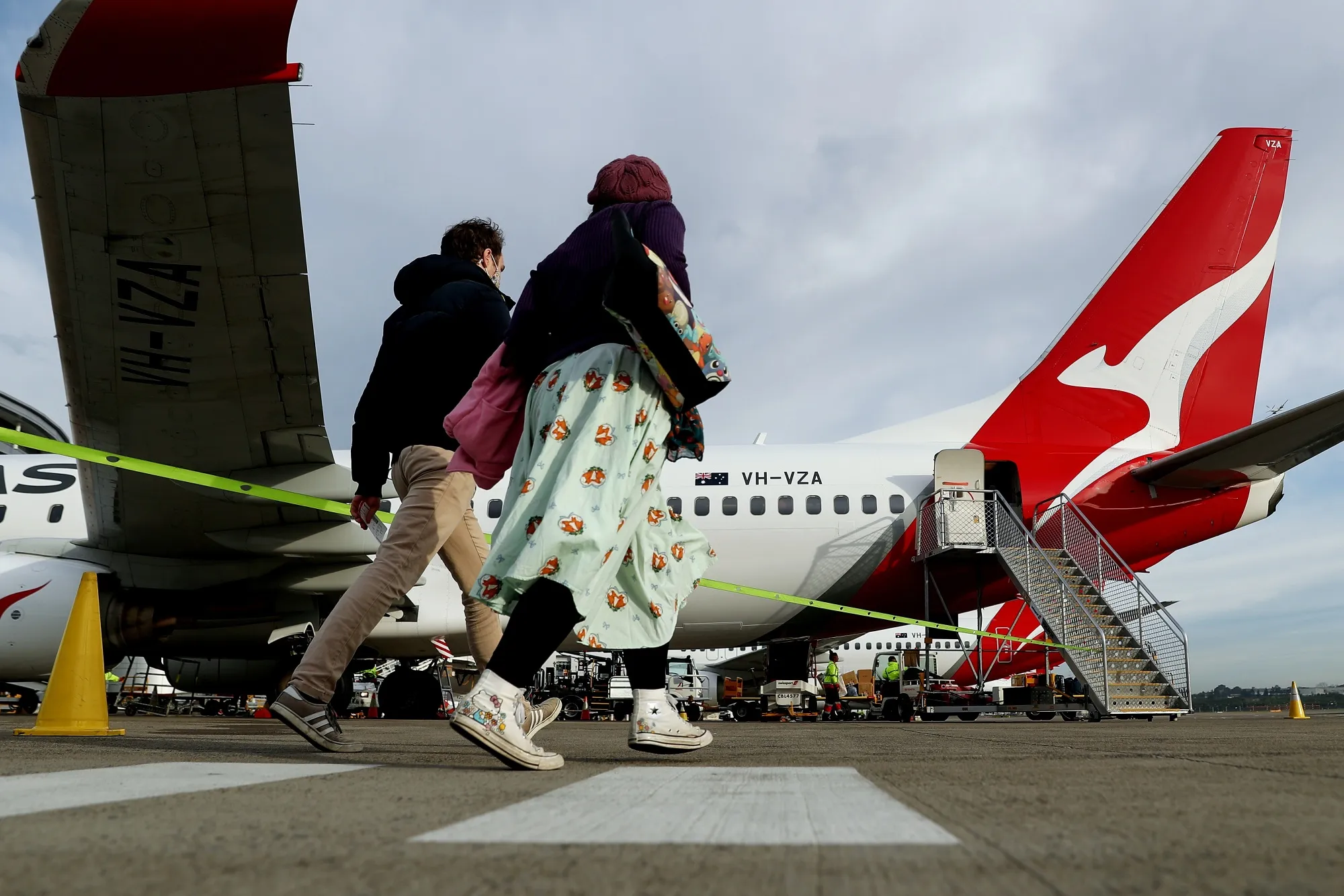 Travelers prepare to board a&nbsp;Qantas Airways flight in Sydney, Australia.
