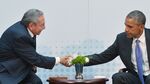US President Barack Obama (R) shakes hands with Cuba's President Raul Castro during a meeting on the sidelines of the Summit of the Americas at the ATLAPA Convention center on April 11, 2015 in Panama City.