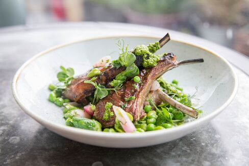 Cornish lamb chops are served with spring vegetables.