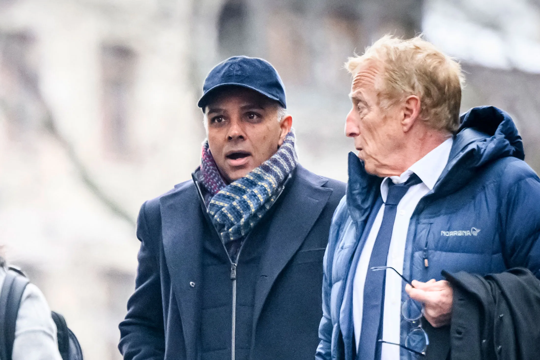 Ajay Hinduja, left, arrives at court in Geneva in January.