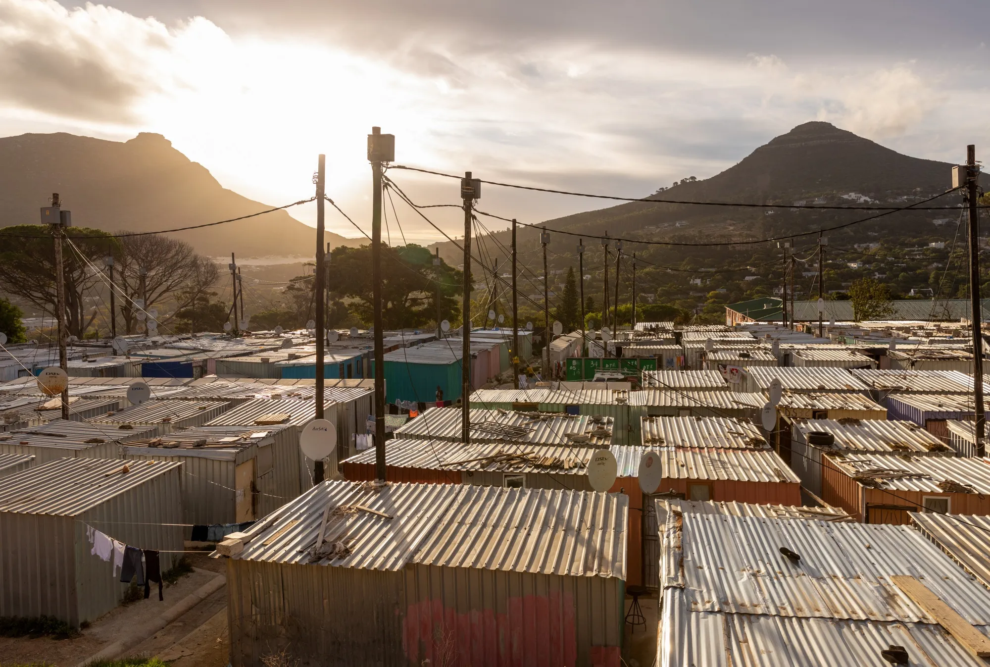 Power lines in the Imizamo Yethu informal settlement in the Hout Bay district of Cape Town, South Africa.