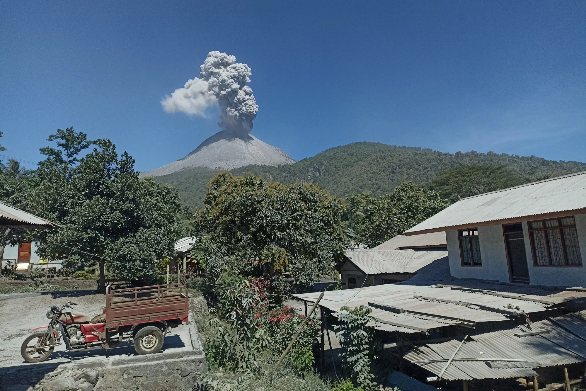 URGENT Volcanic eruption burns houses in Indonesia, killing at least 9