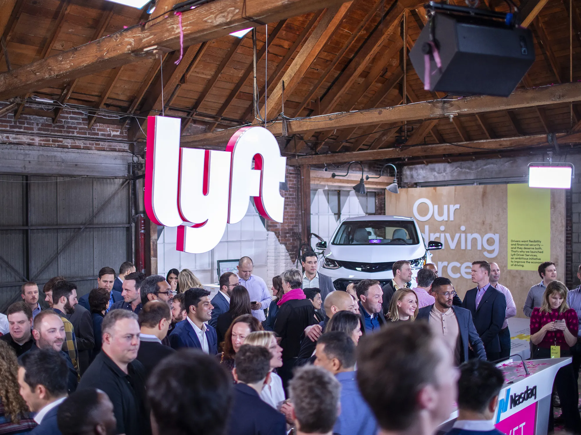 People celebrate Lyft’s initial public offering at the company's service center in Los Angeles in 2019.