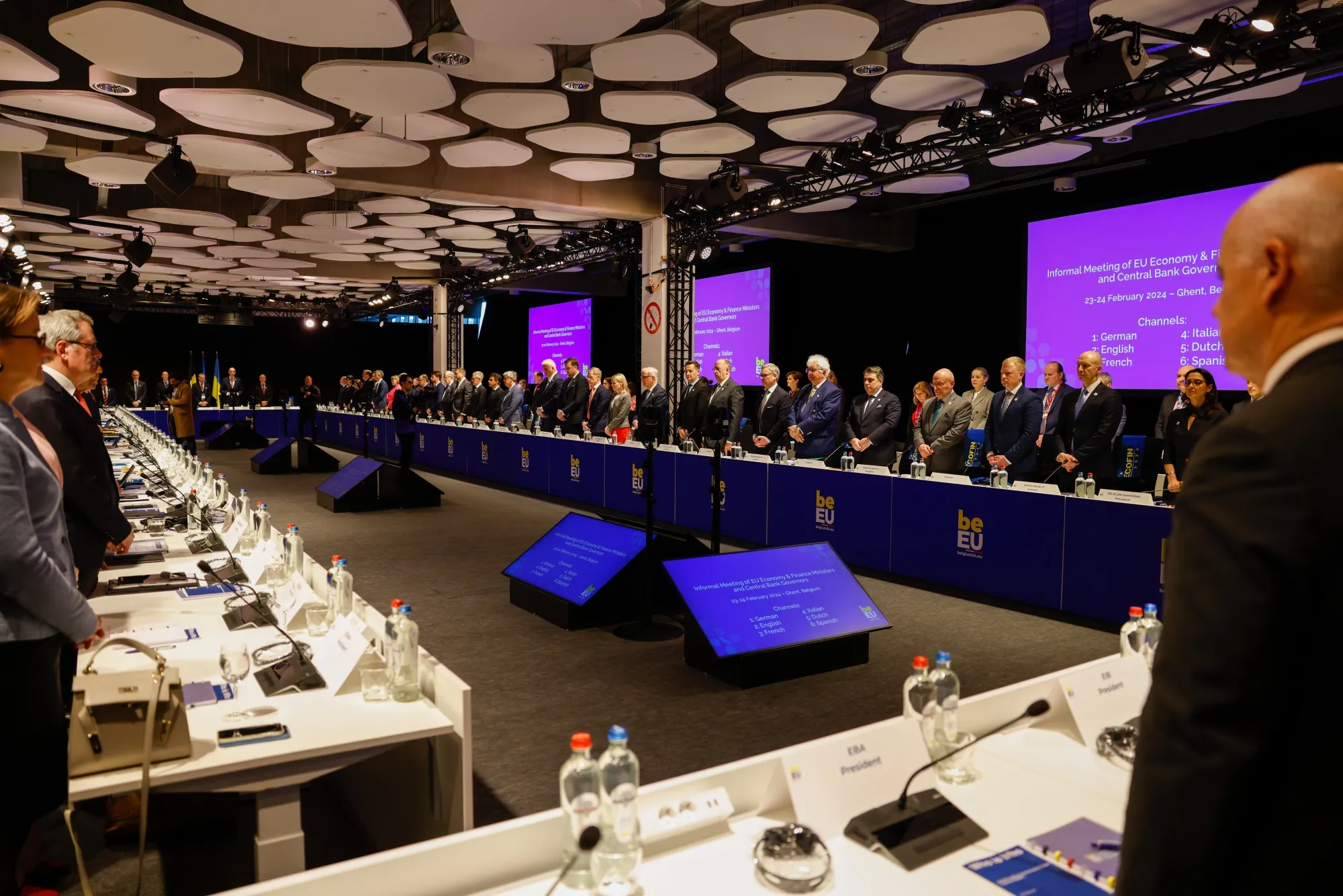 European Union finance chiefs stand as a mark of respect for Ukraine at an informal meeting of European Union economic and financial affairs ministers in Ghent, Belgium, on Feb. 23.