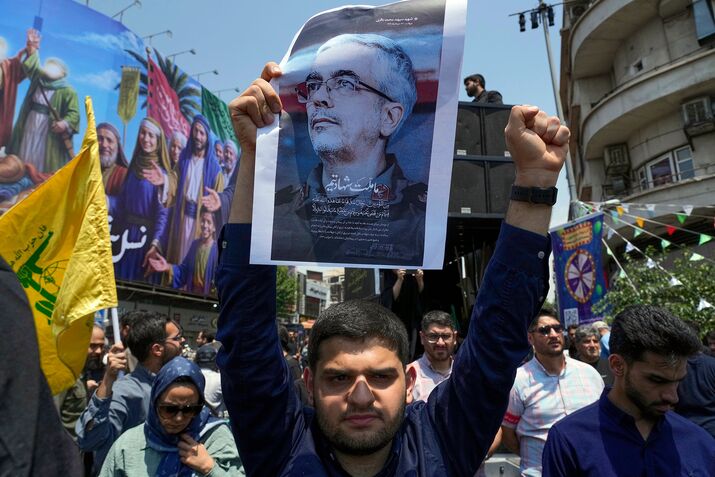 A protester holds a poster of Mohammad Bagheri, in Tehran on June 13.
