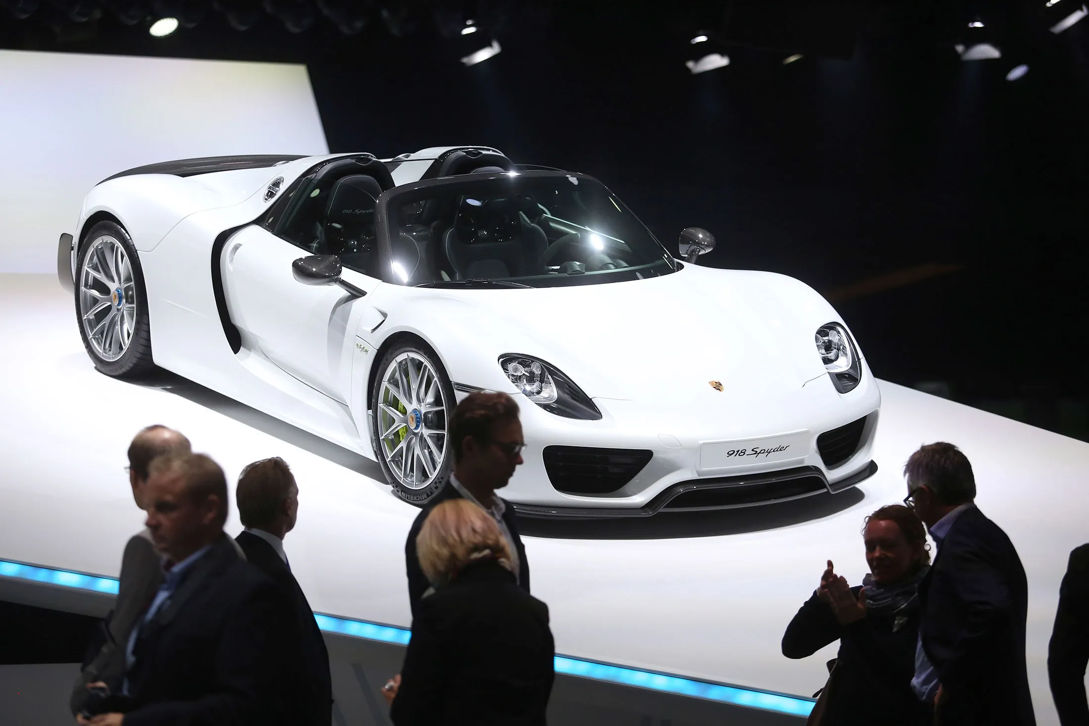Visitors look at a Porsche AG 918 Spyder on display in 2015.&nbsp;