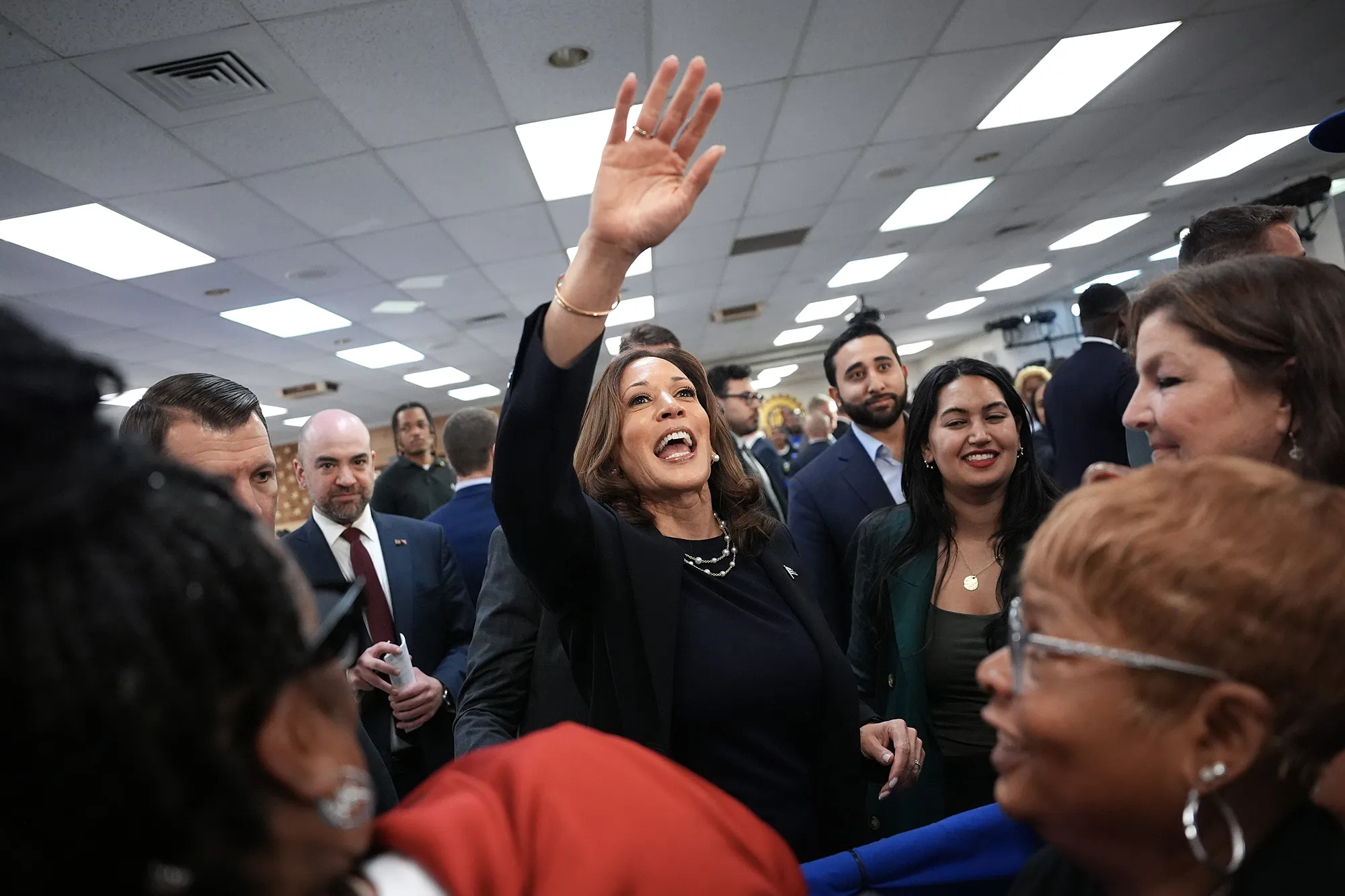 Kamala Harris greets audience members at a campaign rally at United Auto Workers Local 900 in Wayne, Michigan on Aug. 8.